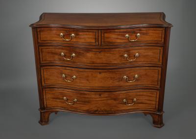 Thomas Chippendale A George III Serpentine Fronted Chest of Drawers in the Manner of Chippendale