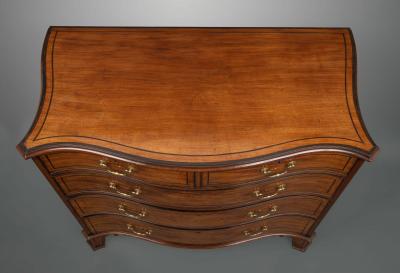 Thomas Chippendale A George III Serpentine Fronted Chest of Drawers in the Manner of Chippendale
