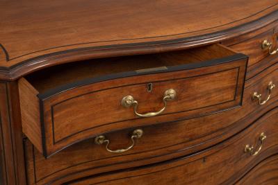 Thomas Chippendale A George III Serpentine Fronted Chest of Drawers in the Manner of Chippendale