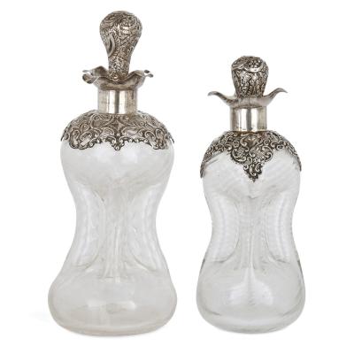 Three English sterling silver and cut glass bottles