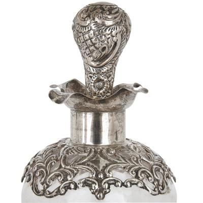 Three English sterling silver and cut glass bottles