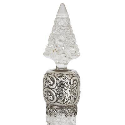Three English sterling silver and cut glass bottles