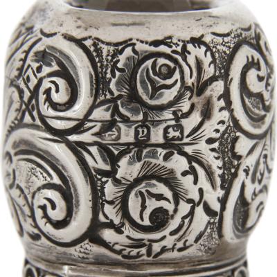 Three English sterling silver and cut glass bottles