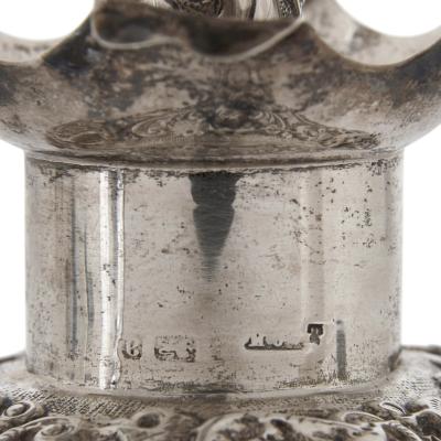 Three English sterling silver and cut glass bottles