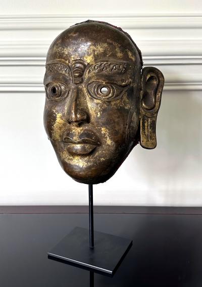 Tibetan Gilt Copper Alloy Mask on Display Stand