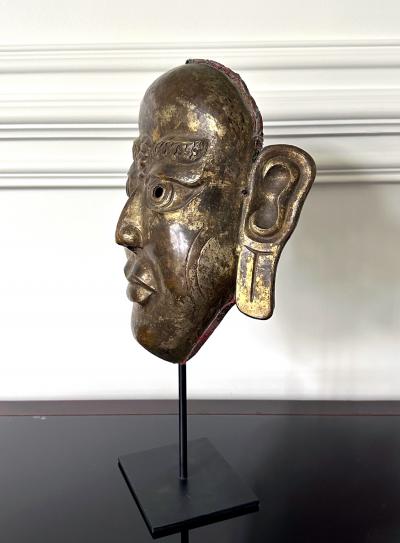 Tibetan Gilt Copper Alloy Mask on Display Stand
