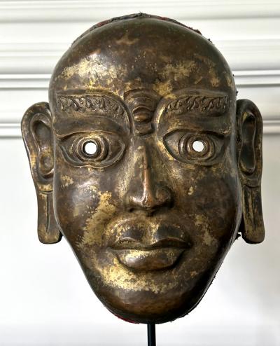 Tibetan Gilt Copper Alloy Mask on Display Stand