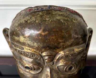 Tibetan Gilt Copper Alloy Mask on Display Stand