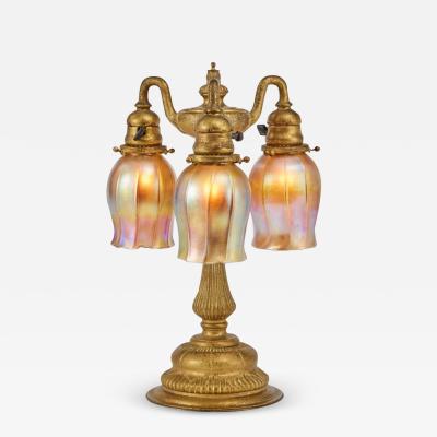 Tiffany Studios Tiffany Studios Gilt Bronze Three Light Favrile Table Lamp