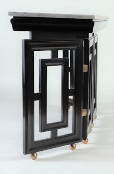 Tommi Parzinger A pair of Mid Century Modern ebonized marble top console tables circa 1950