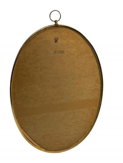 Tommi Parzinger MID CENTURY BRASS FRAMED OVAL MIRROR WITH RING IN THE MANNER OF TOMMI PARZINGER