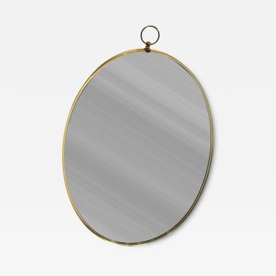 Tommi Parzinger MID CENTURY BRASS FRAMED OVAL MIRROR WITH RING IN THE MANNER OF TOMMI PARZINGER