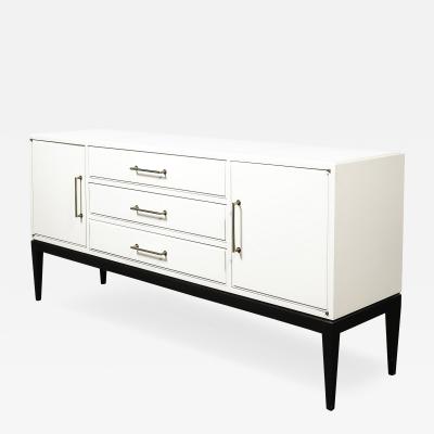 Tommi Parzinger Mid Century Cream Lacquer w Black Lacquer Supports Sideboard by Tommi Parzinger