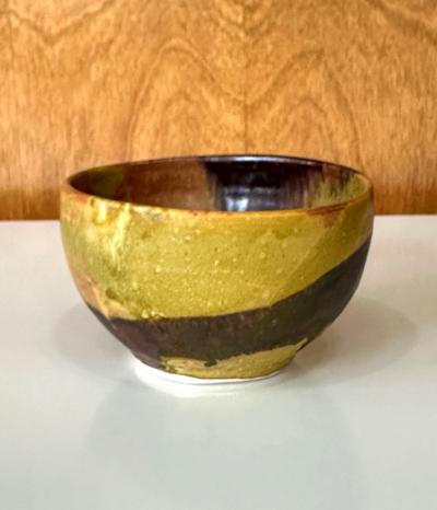 Toshiko Takaezu Ceramic Tea Bowl with Mottled Yellow Glaze by Toshiko Takaezu