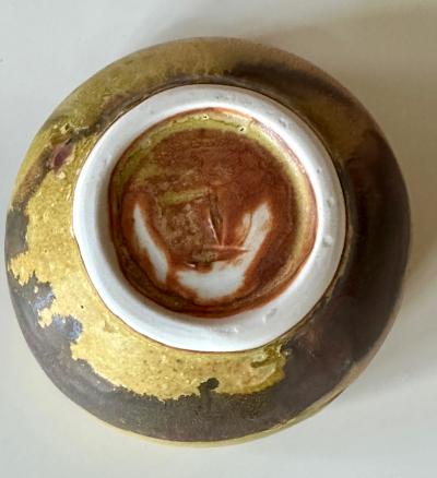 Toshiko Takaezu Ceramic Tea Bowl with Mottled Yellow Glaze by Toshiko Takaezu