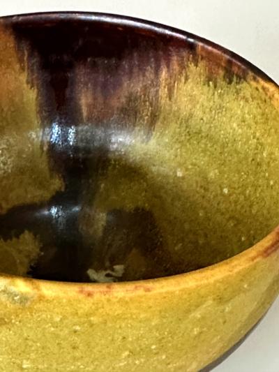 Toshiko Takaezu Ceramic Tea Bowl with Mottled Yellow Glaze by Toshiko Takaezu