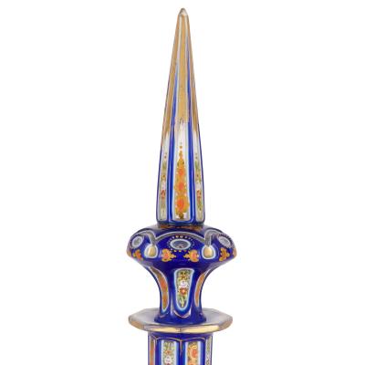 Two Bohemian enamelled blue overlay cut glass decanters