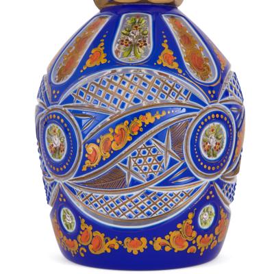 Two Bohemian enamelled blue overlay cut glass decanters