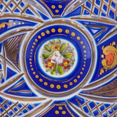 Two Bohemian enamelled blue overlay cut glass decanters