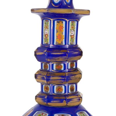 Two Bohemian enamelled blue overlay cut glass decanters