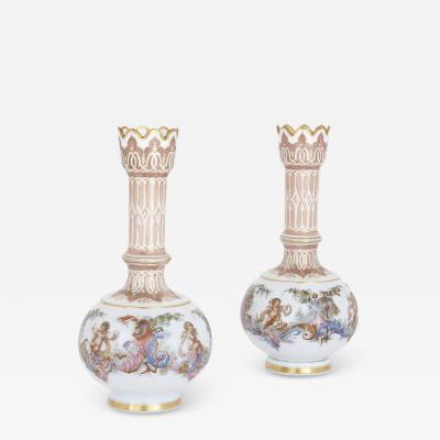 Two Bohemian opaline glass vases with painted cherub scenes