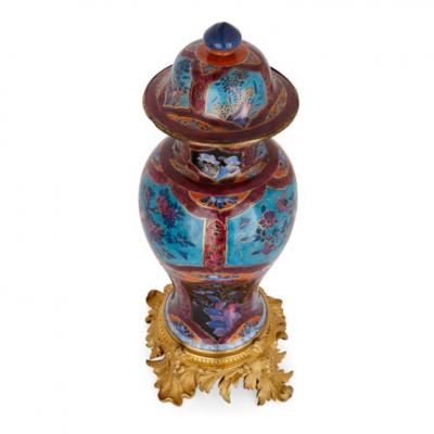 Two Chinese Qing dynasty porcelain vases with gilt bronze bases