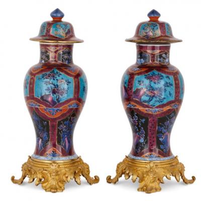 Two Chinese Qing dynasty porcelain vases with gilt bronze bases