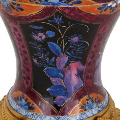 Two Chinese Qing dynasty porcelain vases with gilt bronze bases