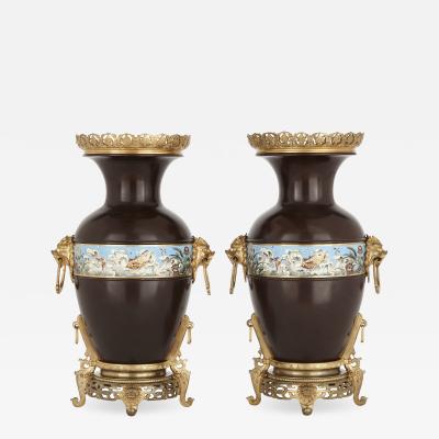 Two Chinese style enamelled gilt and patinated bronze urns