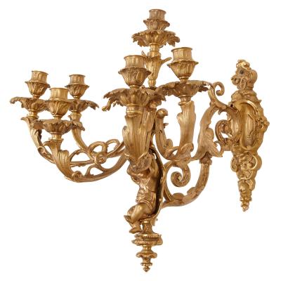 Two French Rococo style gilt bronze six light sconces