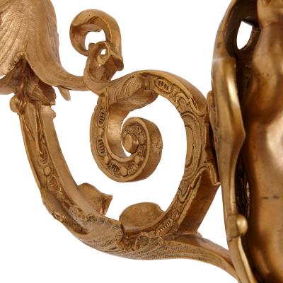 Two French Rococo style gilt bronze six light sconces