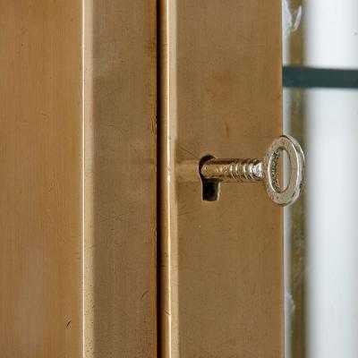Two French burnished brass Art Deco vitrines