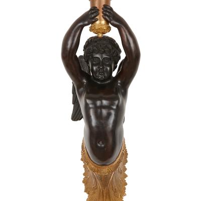 Two French gilt and patinated bronze sconces