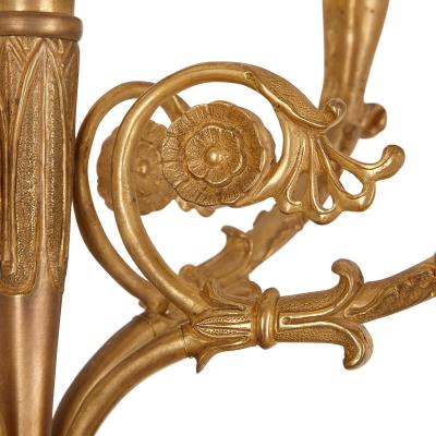 Two French gilt and patinated bronze sconces