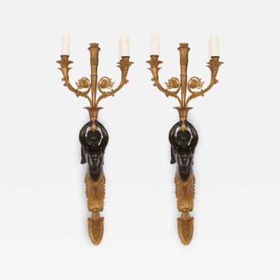 Two French gilt and patinated bronze sconces