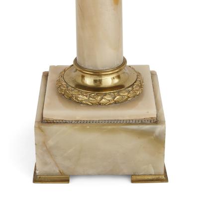 Two French white onyx and gilt bronze column shaped stands