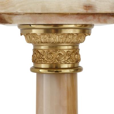 Two French white onyx and gilt bronze column shaped stands