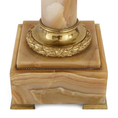 Two French white onyx and gilt bronze column shaped stands