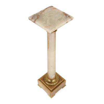 Two French white onyx and gilt bronze column shaped stands