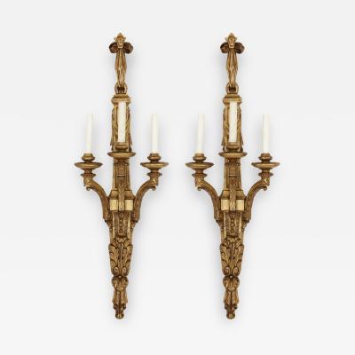 Two Louis XVI style carved giltwood wall sconces