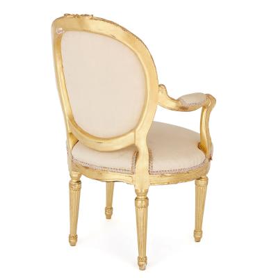Two Louis XVI style giltwood upholstered fauteuil armchairs