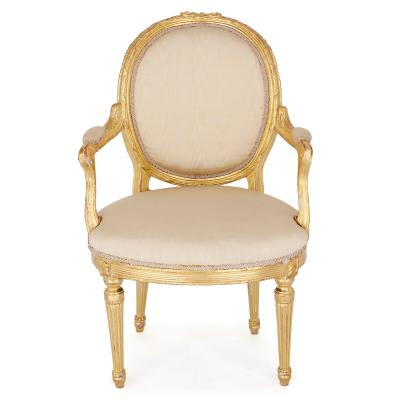 Two Louis XVI style giltwood upholstered fauteuil armchairs