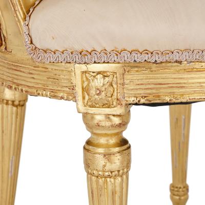 Two Louis XVI style giltwood upholstered fauteuil armchairs