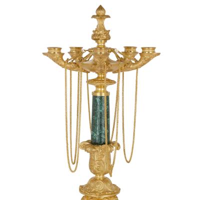 Two Neoclassical early 19th century malachite and gilt bronze candelabra
