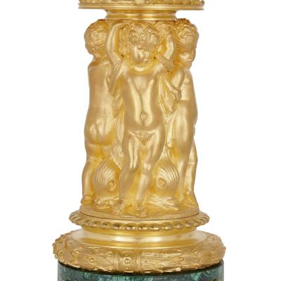 Two Neoclassical early 19th century malachite and gilt bronze candelabra