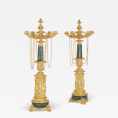 Two Neoclassical early 19th century malachite and gilt bronze candelabra