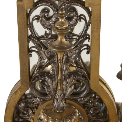 Two Rococo style gilt and silvered metal girandoles