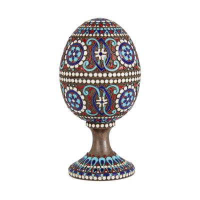Two Russian silver gilt and cloisonn enamel Easter eggs on stands
