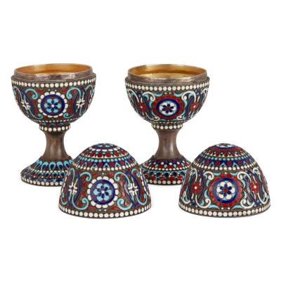 Two Russian silver gilt and cloisonn enamel Easter eggs on stands