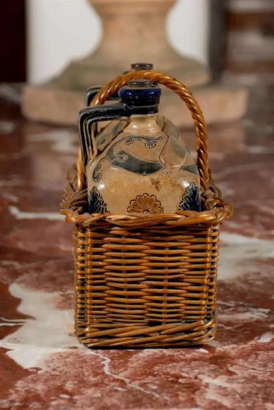 Two Victorian English Pottery Decanters in Tantalus Inspired Wicker Basket
